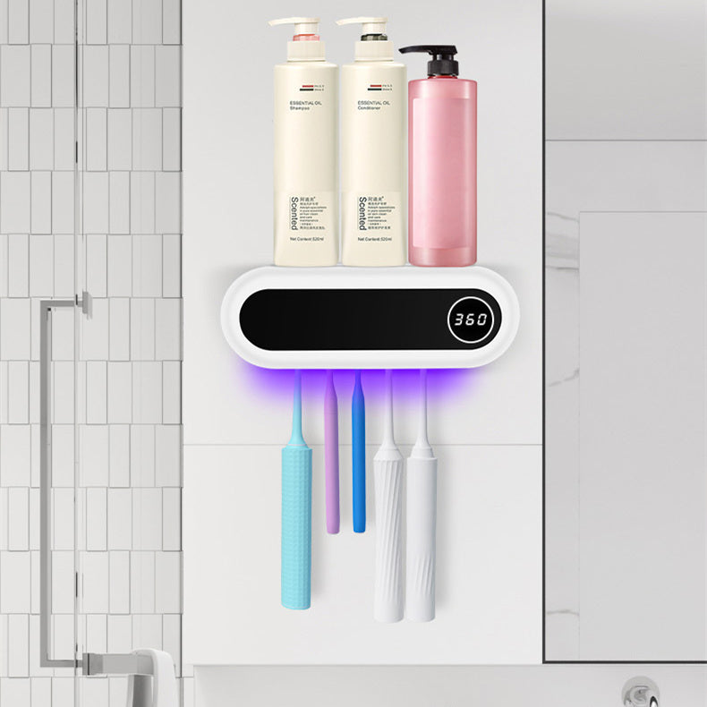 Wall-mounted toothbrush sterilizer and holder with LED display, storing multiple toothbrushes and bottles on top.Wall mounted toothbrush sterilizer and holder with LED display, storing multiple toothbrushes and bottles on top.