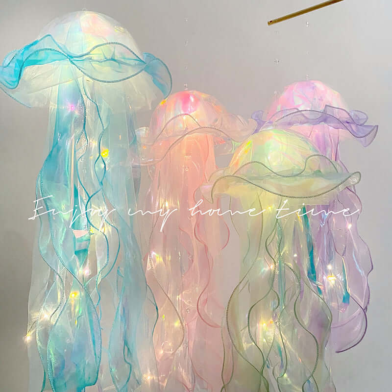 Pastel-colored LED jellyfish lamps hanging in a bright room with decorative ambient lighting.