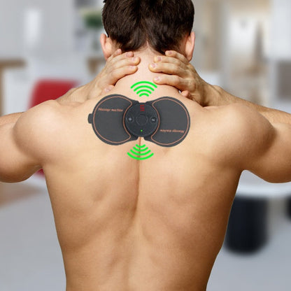 A man using a wearable electronic muscle stimulator device on his upper back for pain relief or massage therapy A man using a wearable electronic muscle stimulator device on his upper back for pain relief or massage therapy.