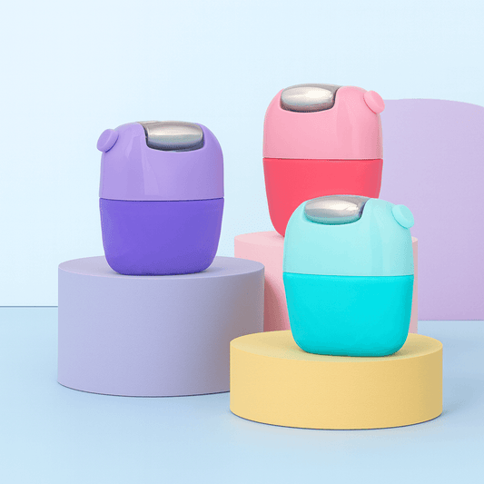 Glow Up Ice Roller in assorted colors – purple, blue, and pink silicone tools on white background