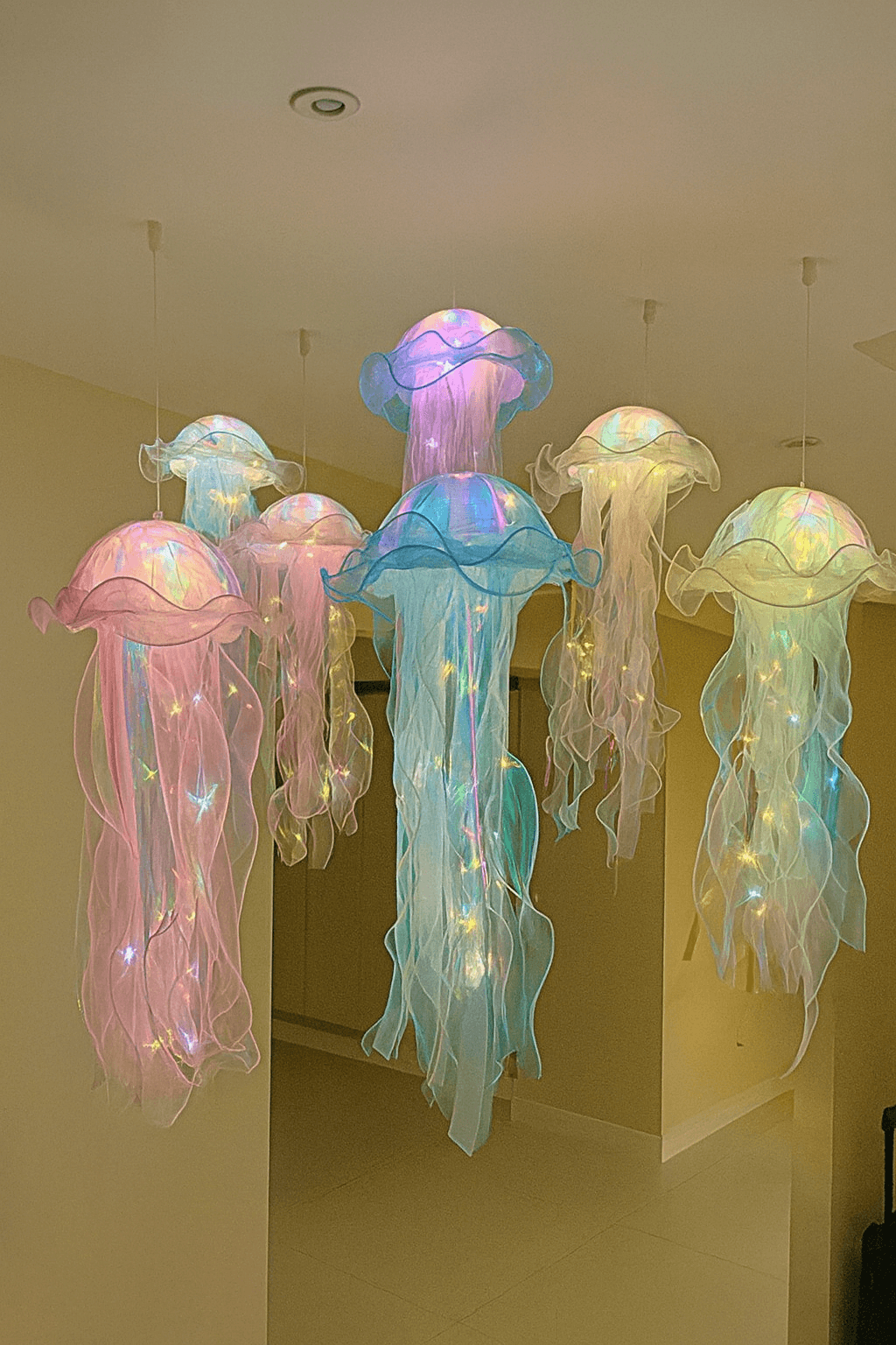 LED Jellyfish Lamp showing floating jellyfish with soft pastel lighting