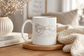 Cat Lover Coffee Mug featuring a sleeping woman with a cat, perfect for cozy mornings.
