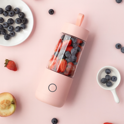 Pink Vitamer blender with fruit slices inside