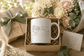 Cat Lover Coffee Mug in a gift box with flowers, featuring a peaceful sleep design for cat lovers.