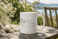 Cat Lover Coffee Mug featuring a serene design of a sleeping woman with a cat, perfect for cozy mornings.
