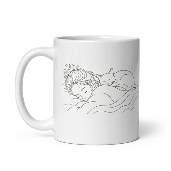 Cat Lover Coffee Mug featuring a design of a woman sleeping with a cat, symbolizing cozy moments.