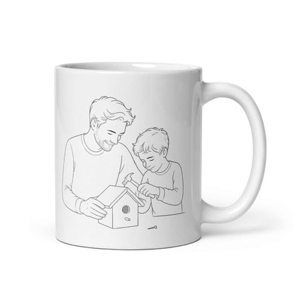 Father & Son Coffee Mug featuring a dad and son building a birdhouse together, celebrating their bond.